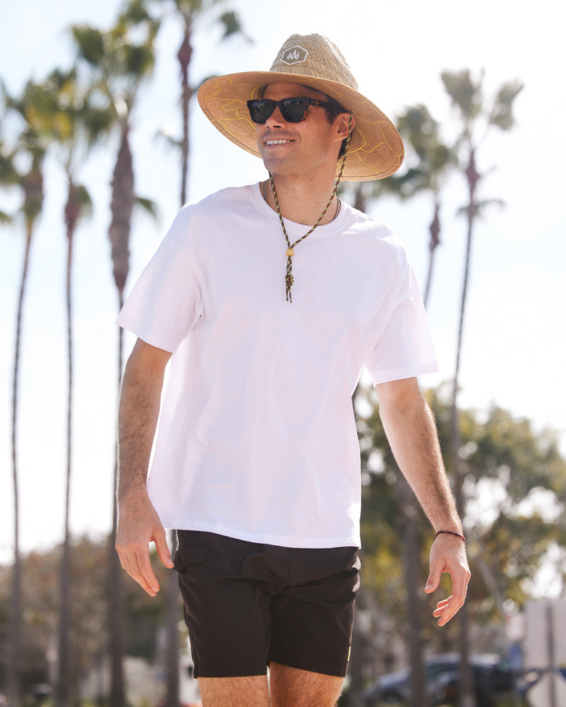 Hemlock male model wearing the UPF50+ Lifeguard Straw Hat Nomad Honey print