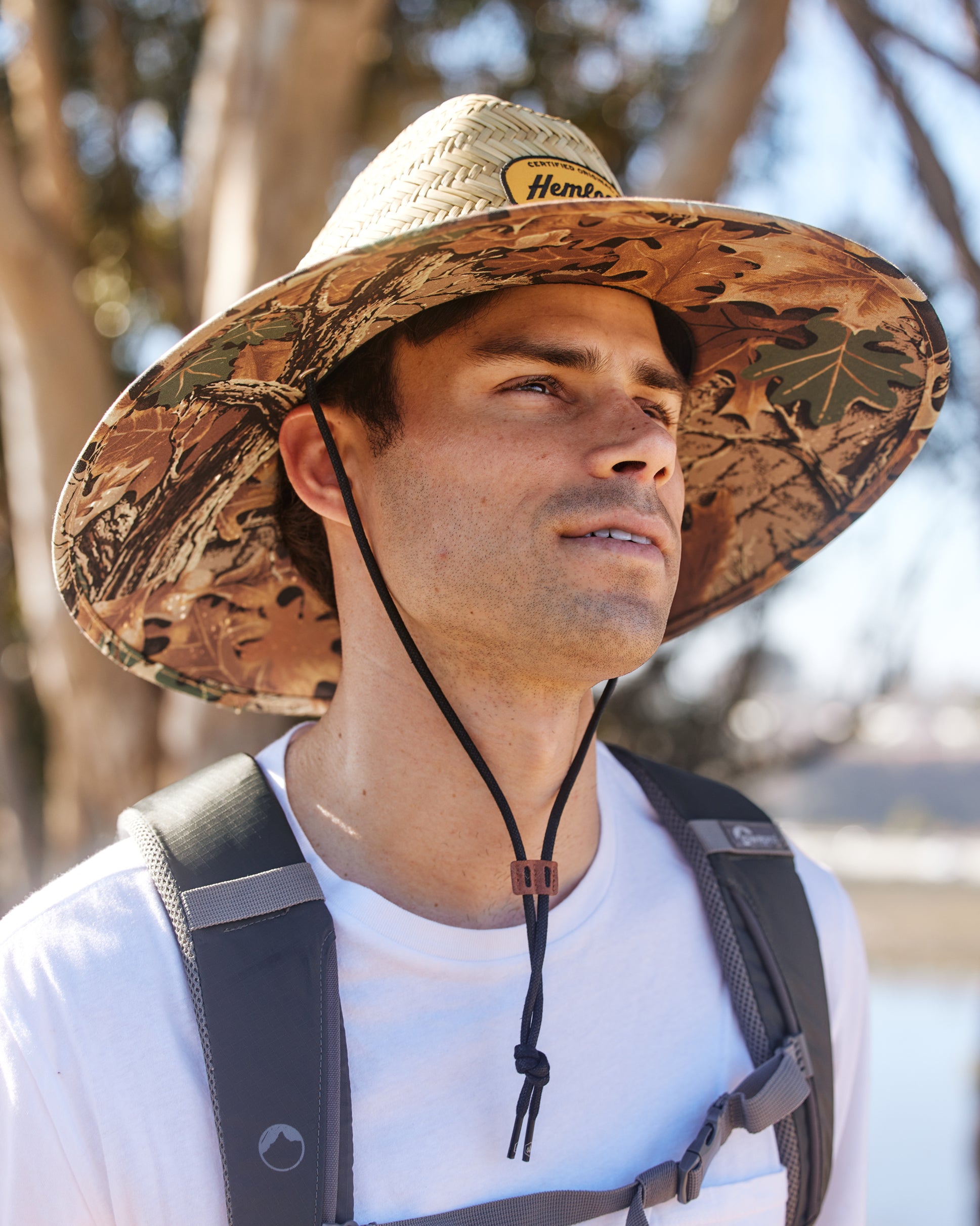 Hemlock male model wearing the UPF50+ Lifeguard Straw Hat Realtree® Advantage Camo print