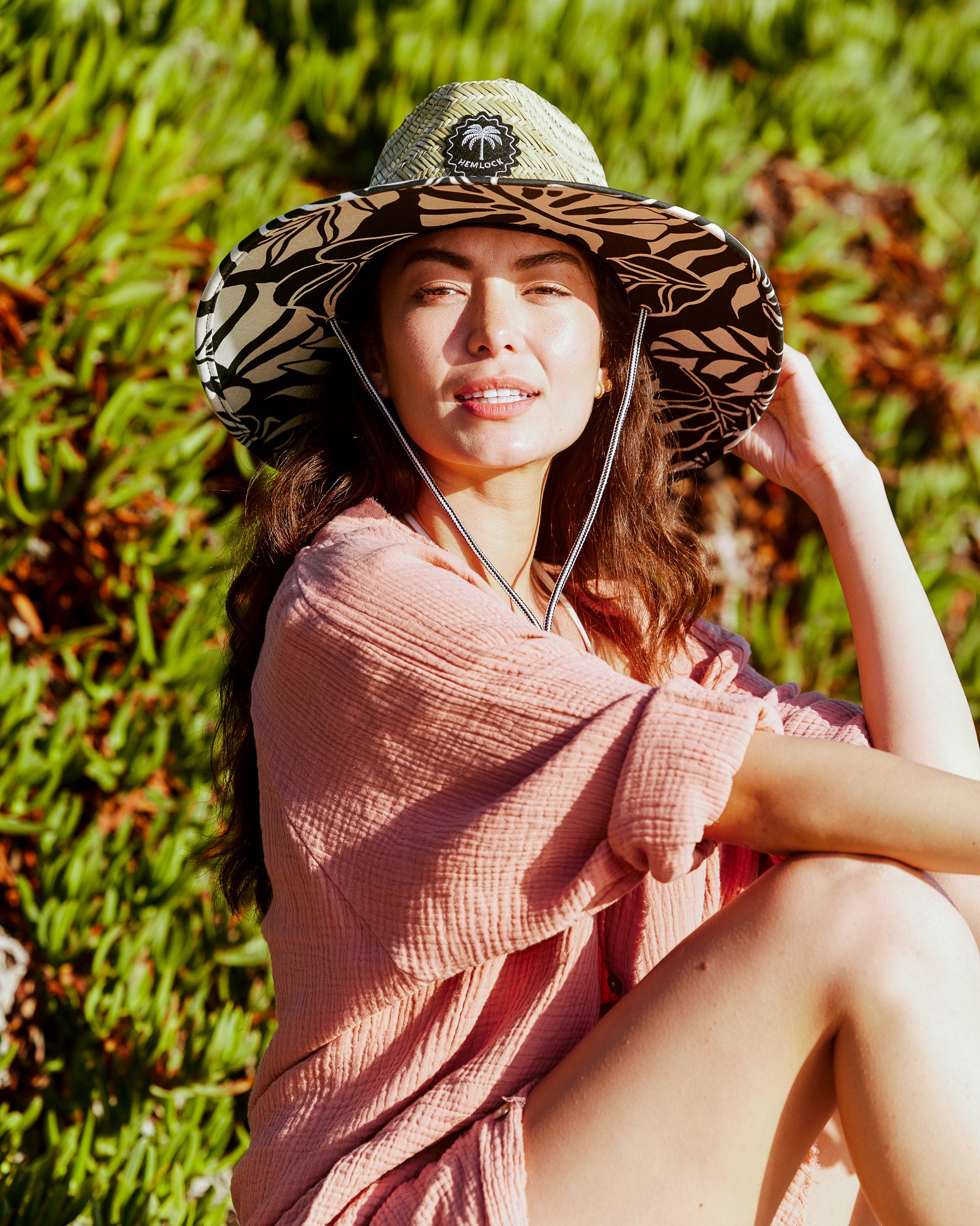 Hemlock female model wearing the UPF50+ Fedora Lifeguard Straw Hat in Monstera print