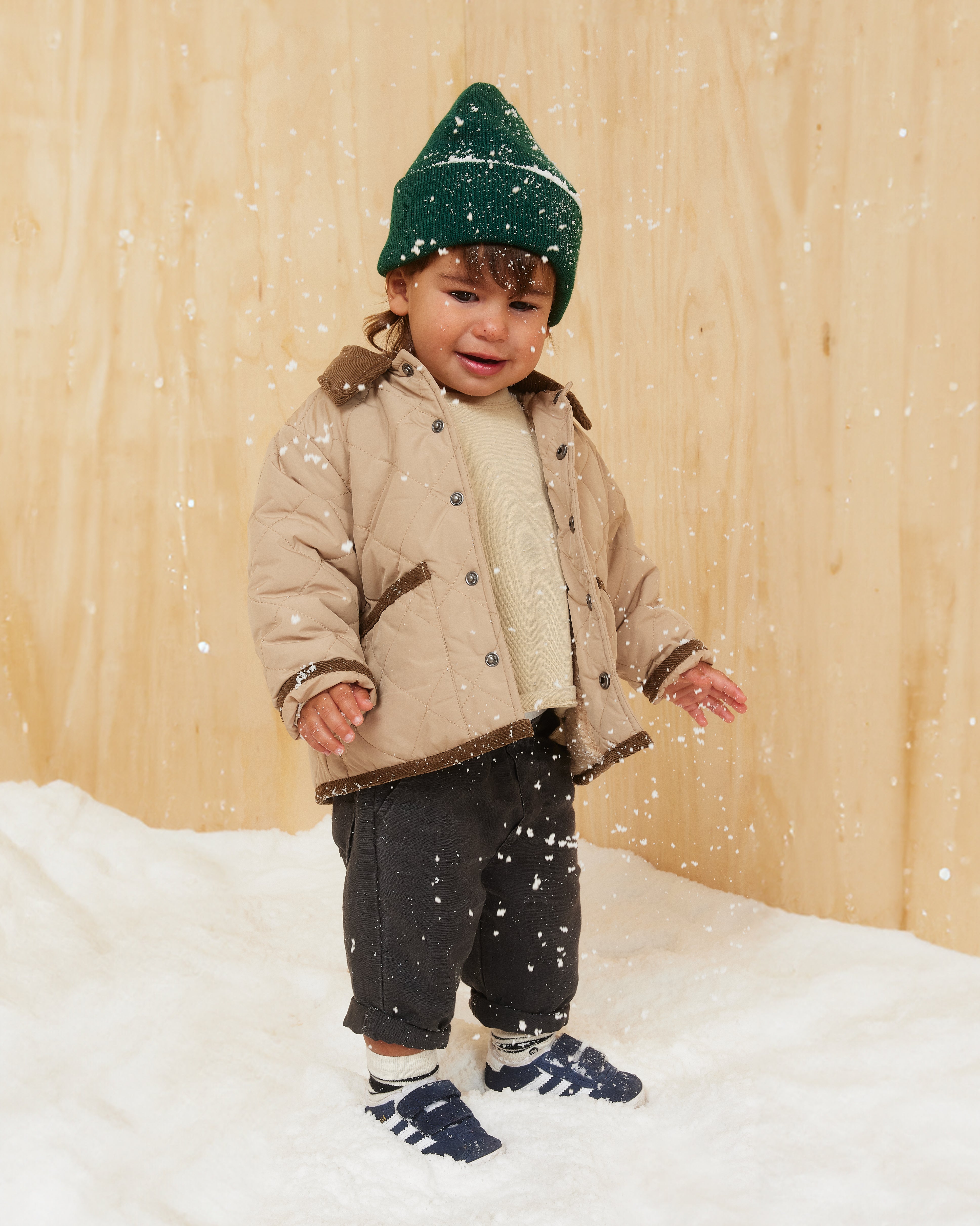 Hemlock baby boy model wearing the Baby Ranger Beanie in Emerald