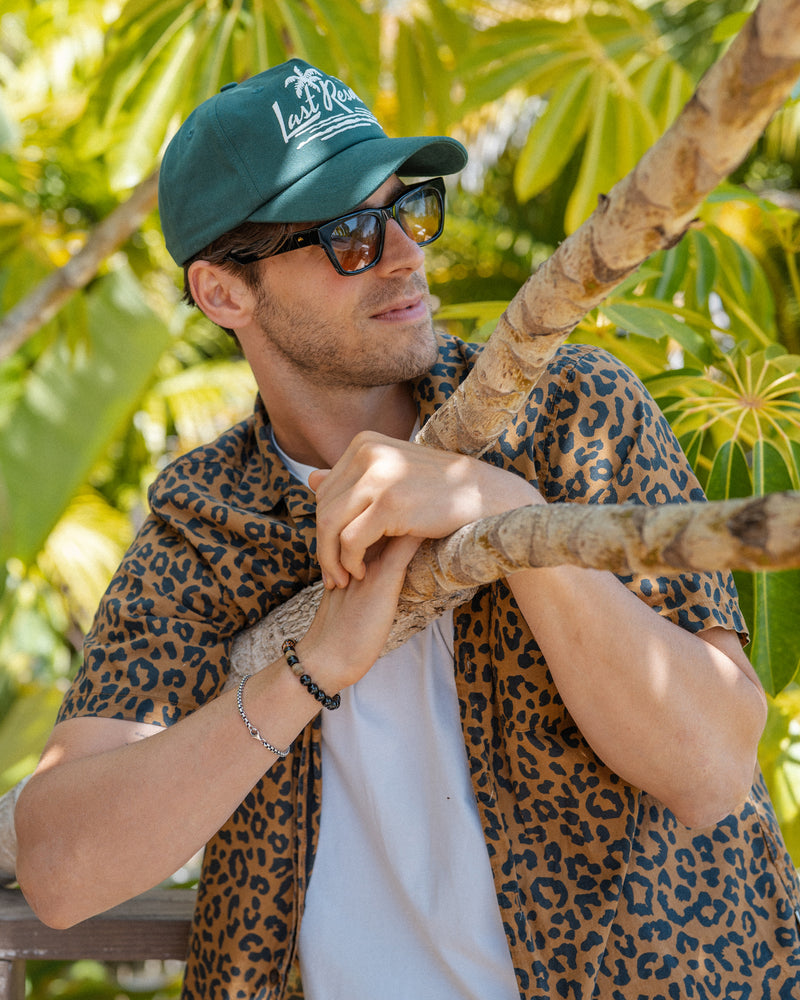 Hemlock male model wearing the Last Resort Baseball Hat in Green