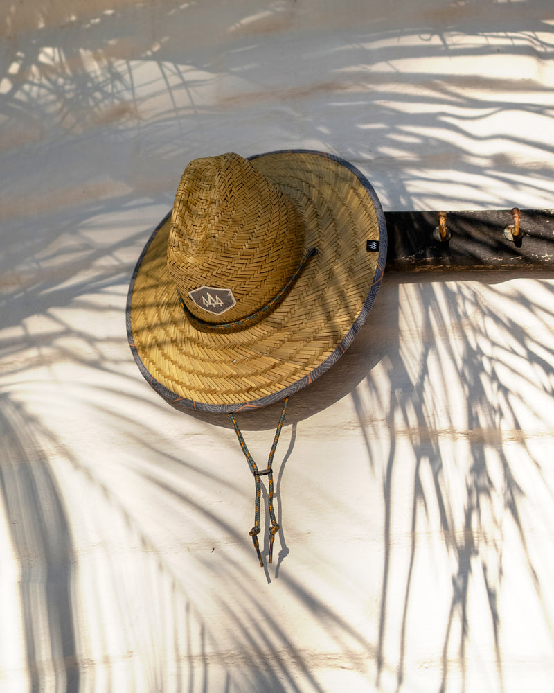 Hemlock Kids UPF50+ Lifeguard Straw Hat in Nomad Blue print hanging on the wall