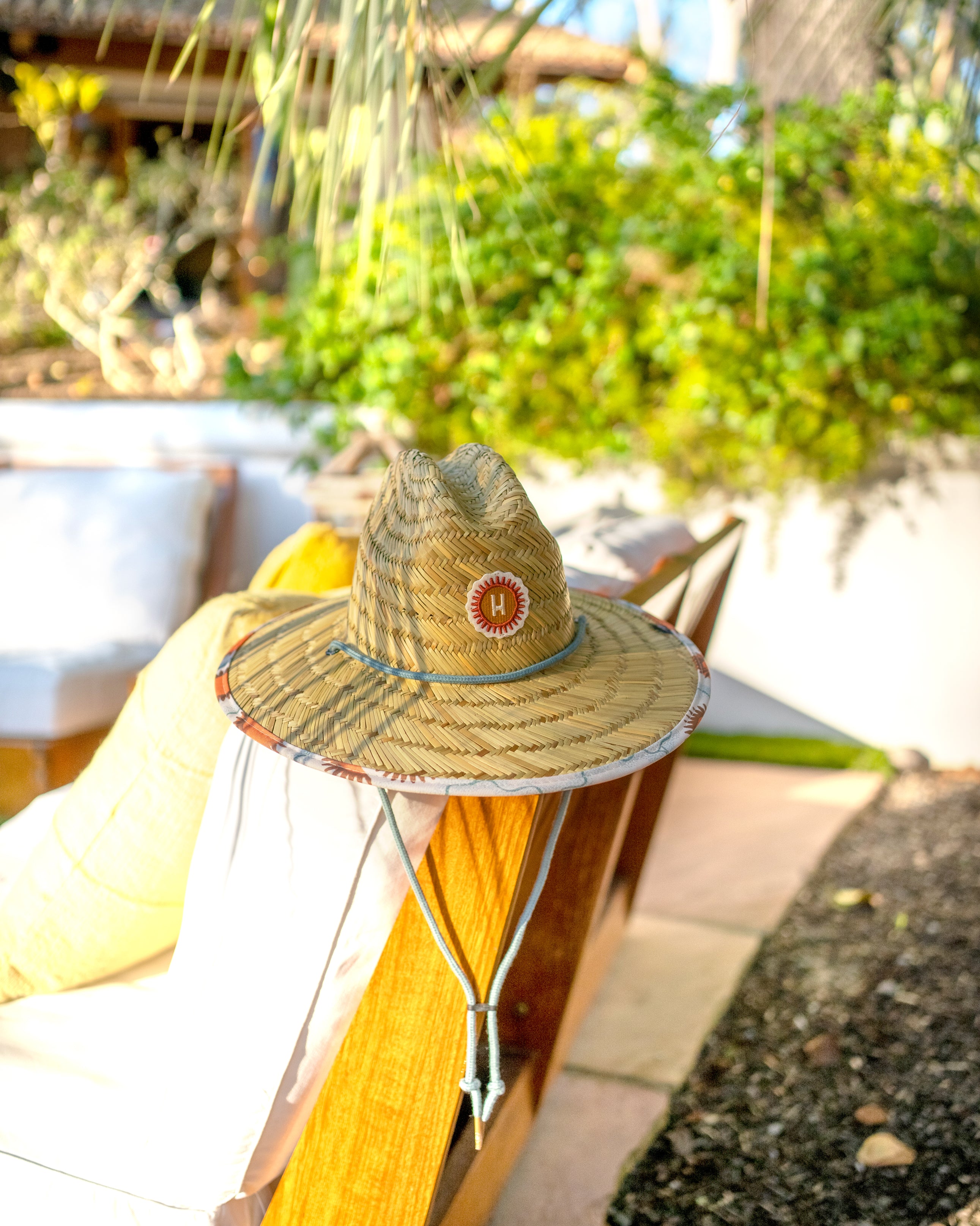 Hemlock Kids UPF50+ Lifeguard Straw Hat in Suns print by pool chair