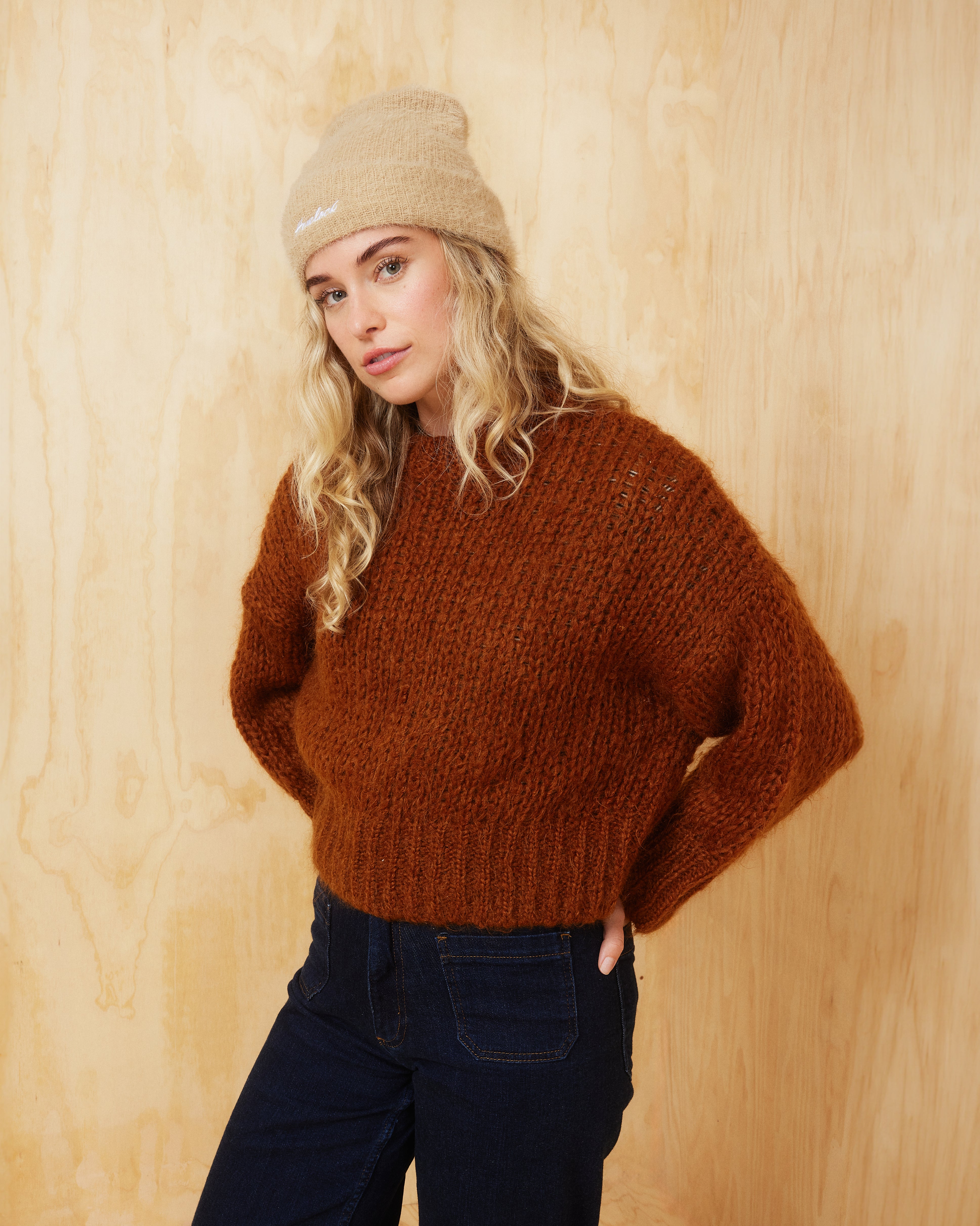 Hemlock Female Model wearing the Ivy Fuzzy Beanie in Oat Color