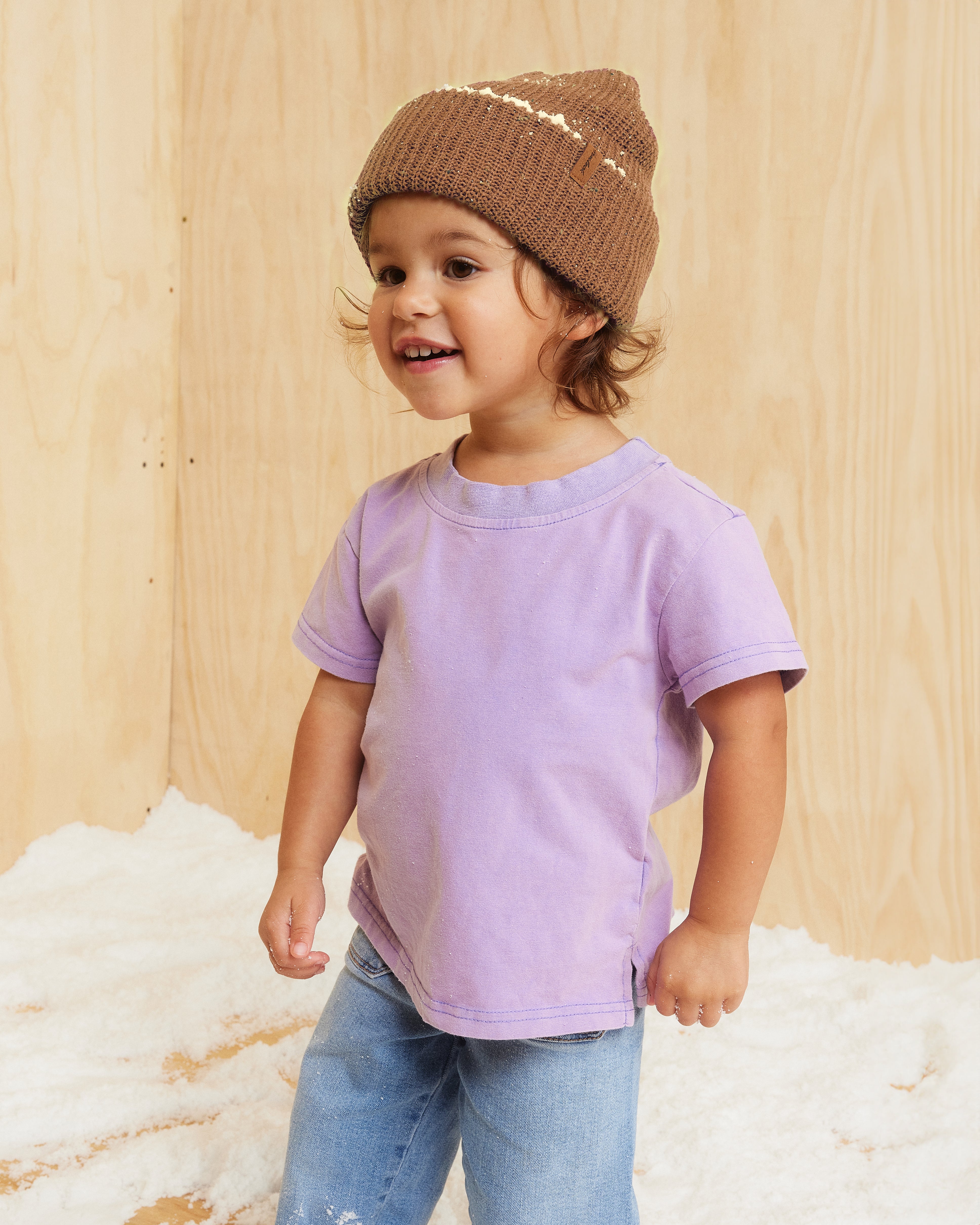 Hemlock little girl model wearing the Toddler Hawthorne Fleck Beanie in Sand color 