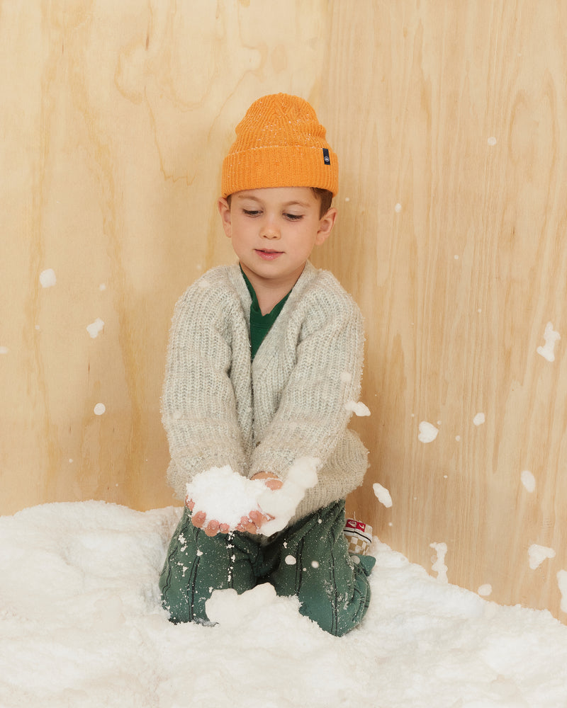 Hemlock little boy model wearing the Toddler Ranger Beanie in Apricot color