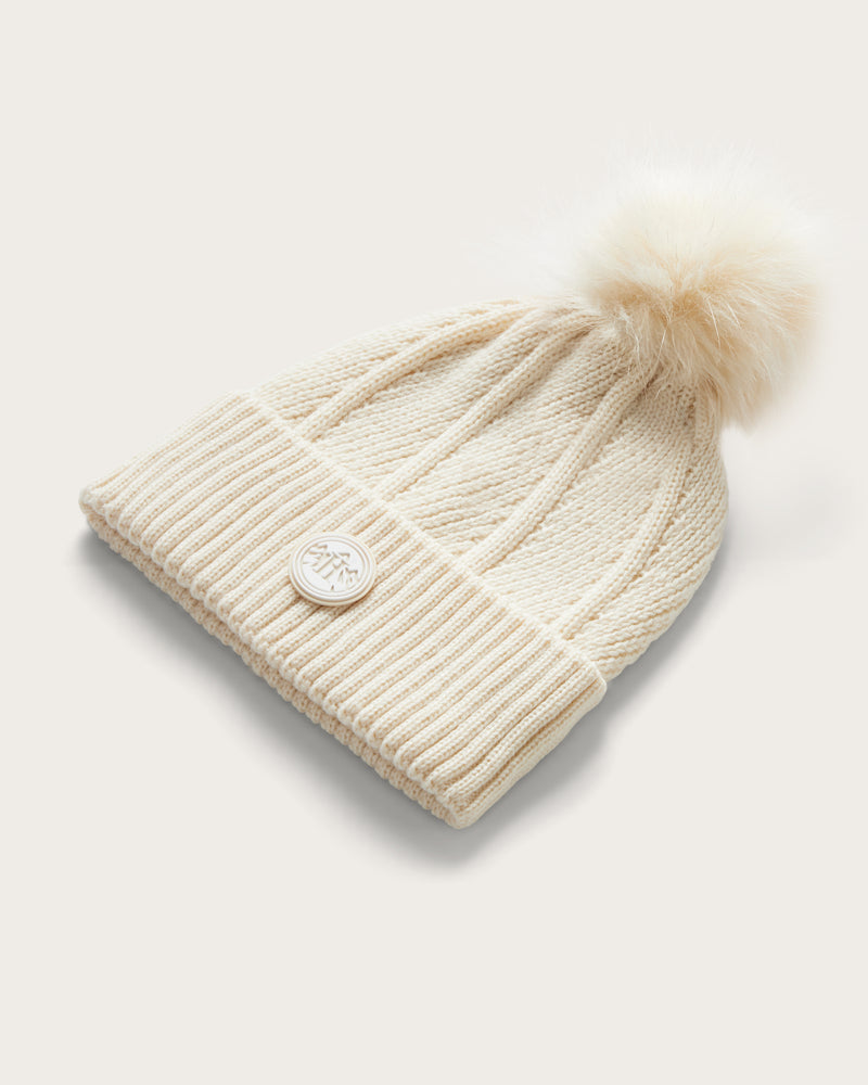 Hemlock Willow Pom beanie in Chalk color with White Pom at an angle