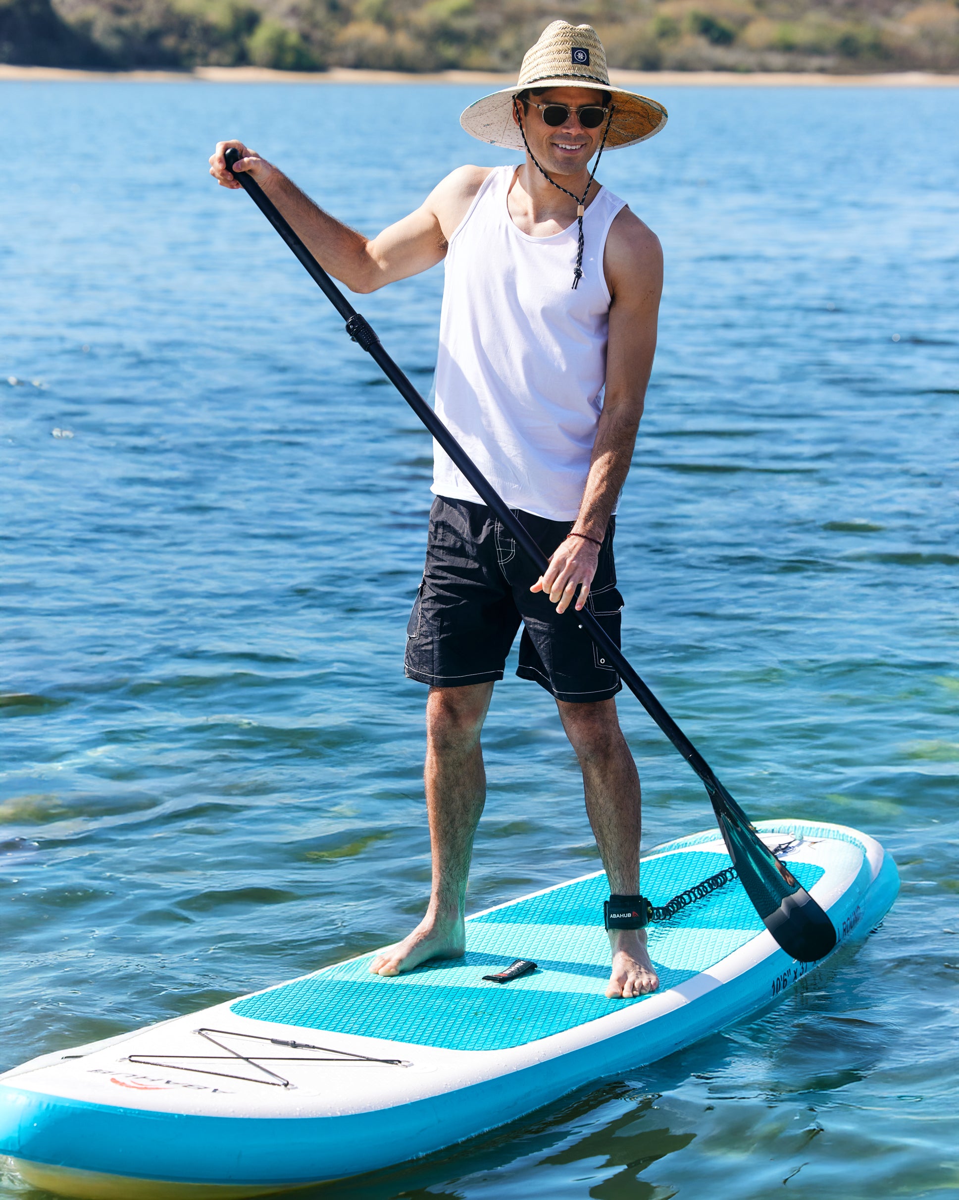 Hemlock male model wearing UPF50+ Lifeguard Straw Hat Latitude print paddle boarding 