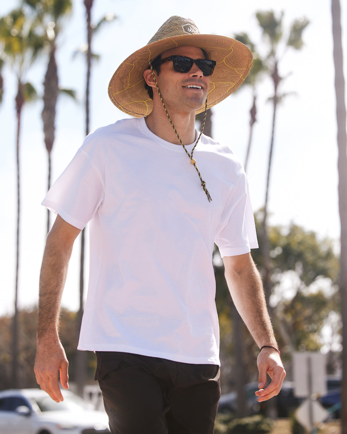 Hemlock male model wearing UPF50+ Lifeguard Straw Hat Nomad Honey print