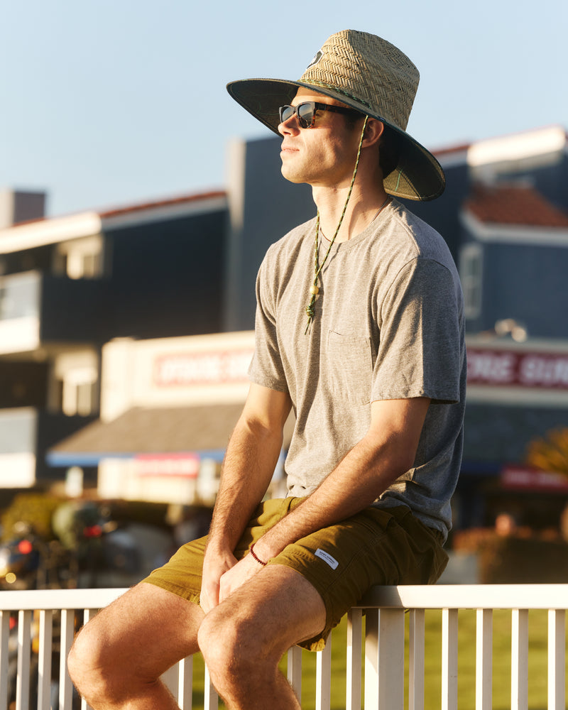 Hemlock male model wearing the UPF50+ Lifeguard Straw Hat Nomad Green print