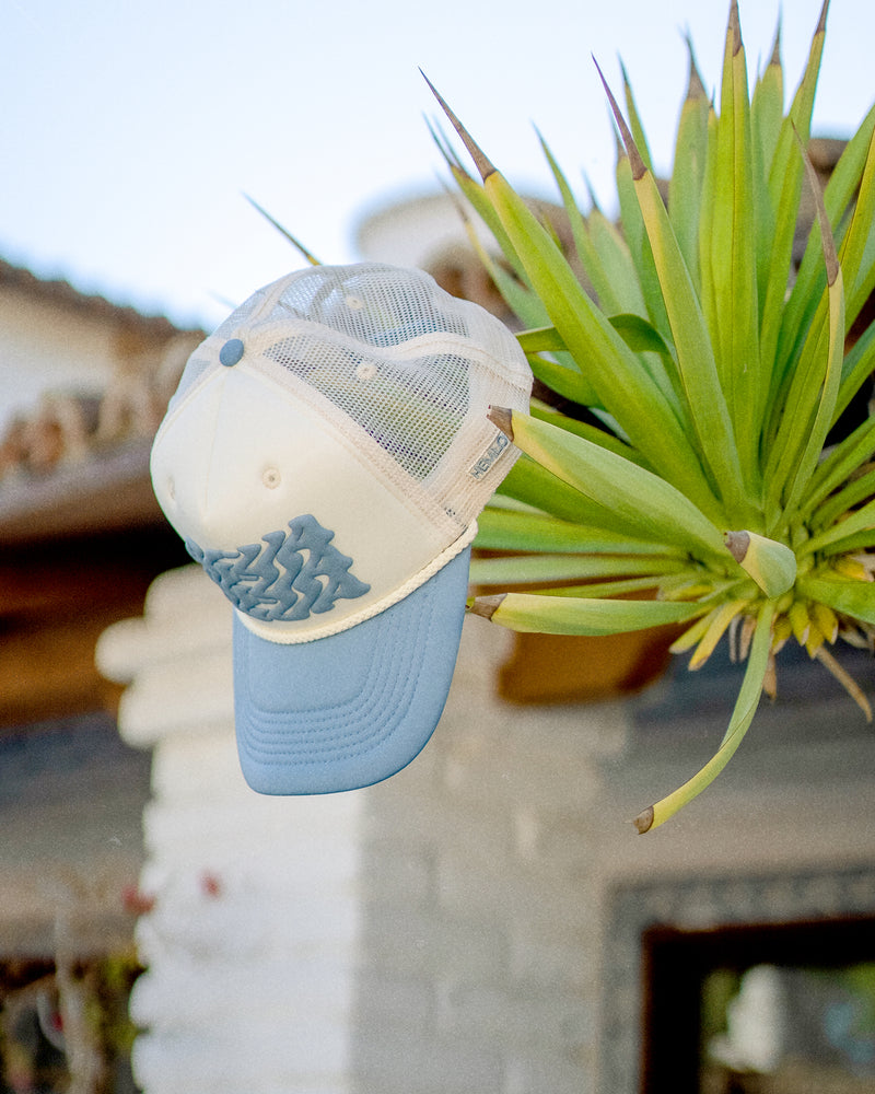 Hemlock Agua Foam Trucker by tree
