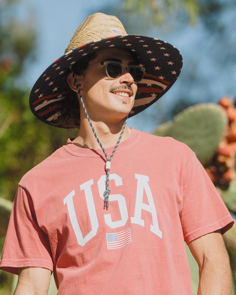 Hemlock male model wearing the UPF50+ Lifeguard Straw Hat Stars & Stripes print