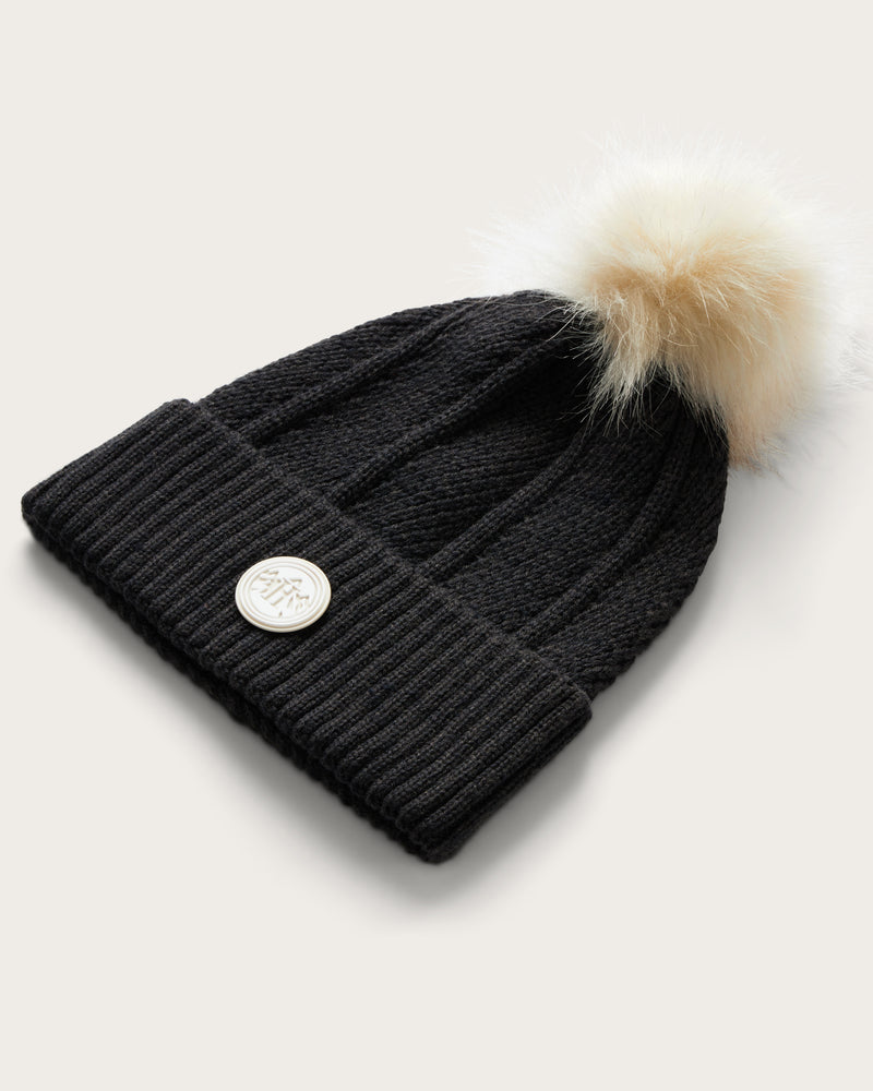 Hemlock Toddler Willow Pom Beanie in Black with white pom at an angle