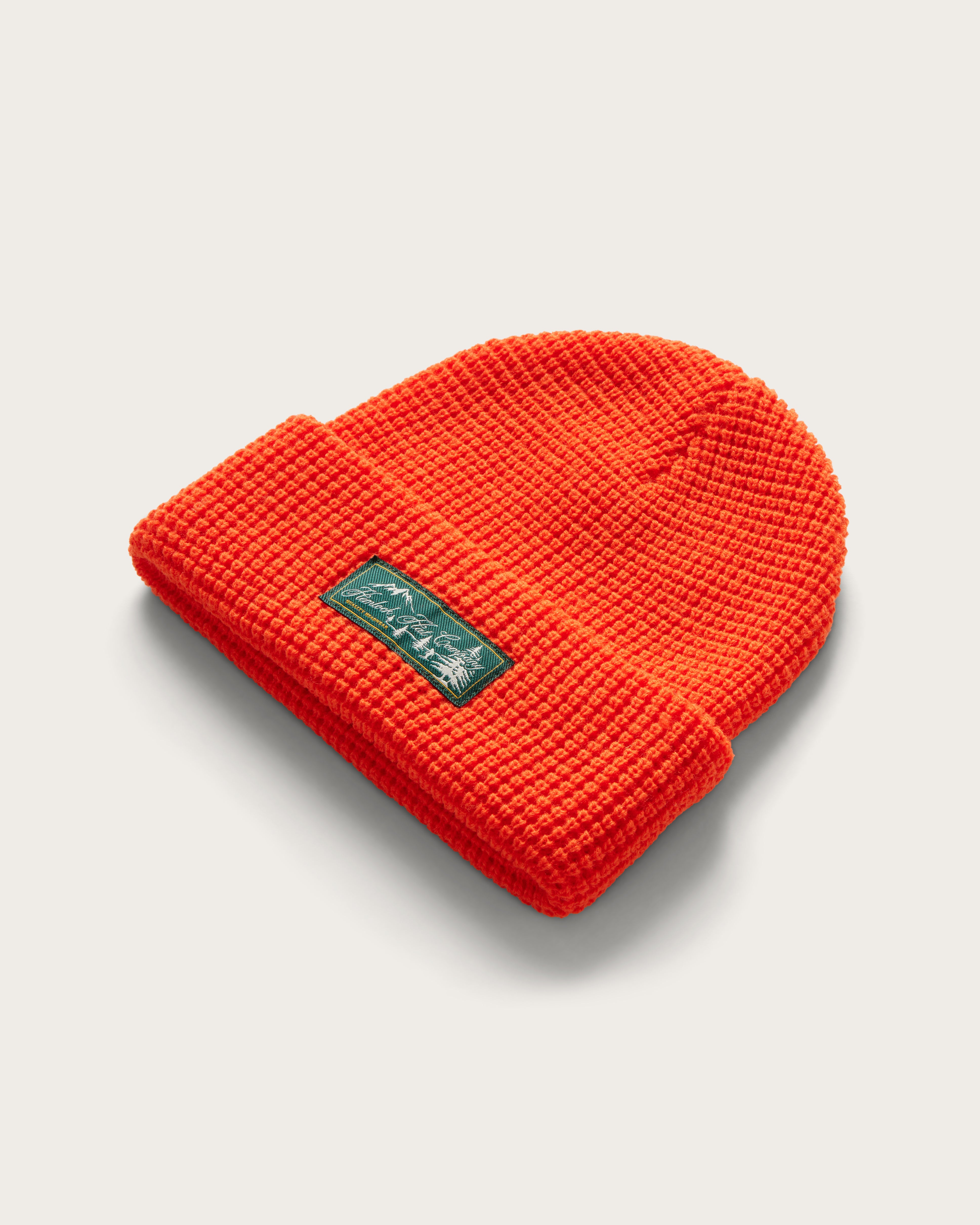 Hemlock Meadows Beanie in Flame color at an angle