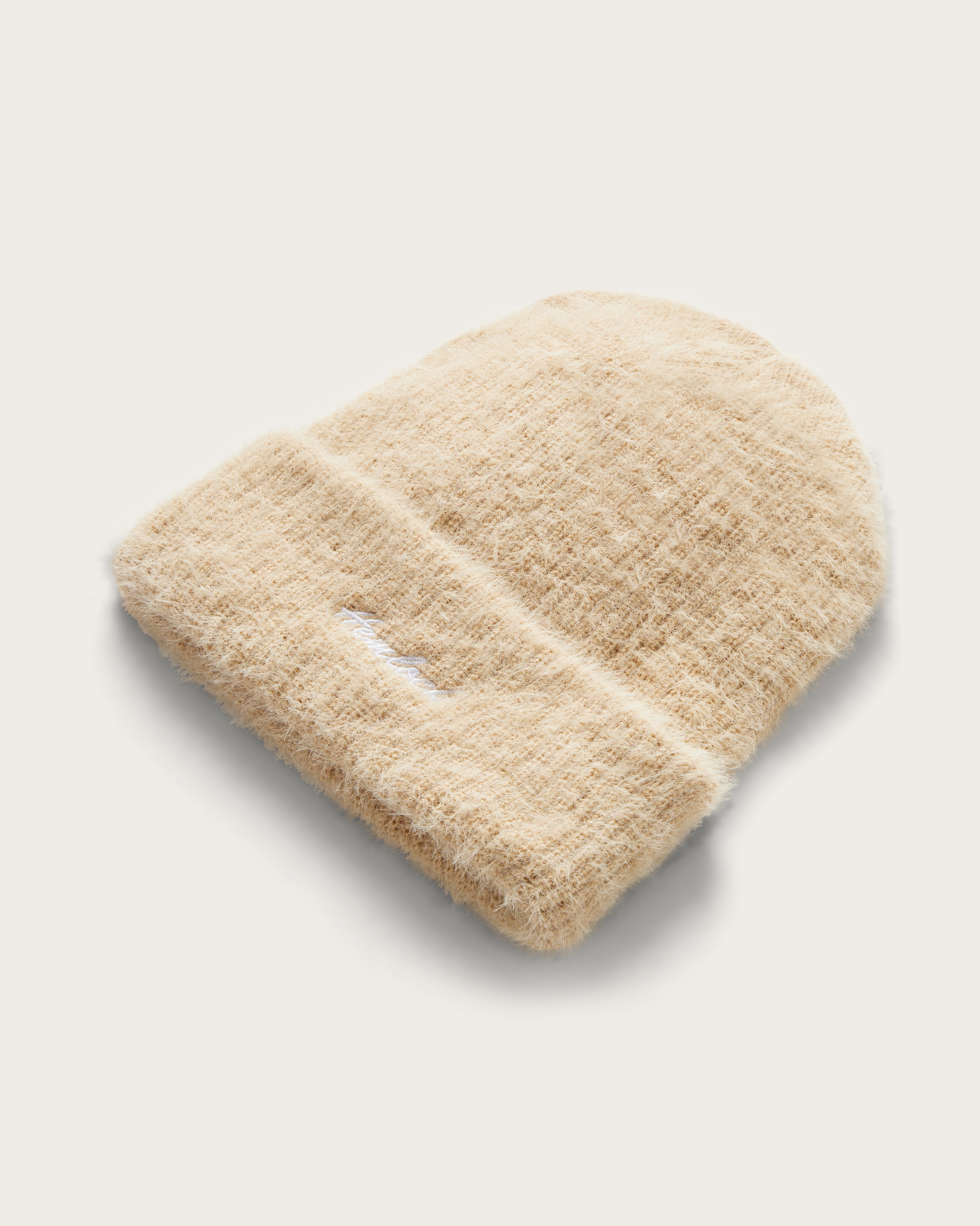 Hemlock Toddler Ivy Fuzzy Beanie in Oat color at an angle