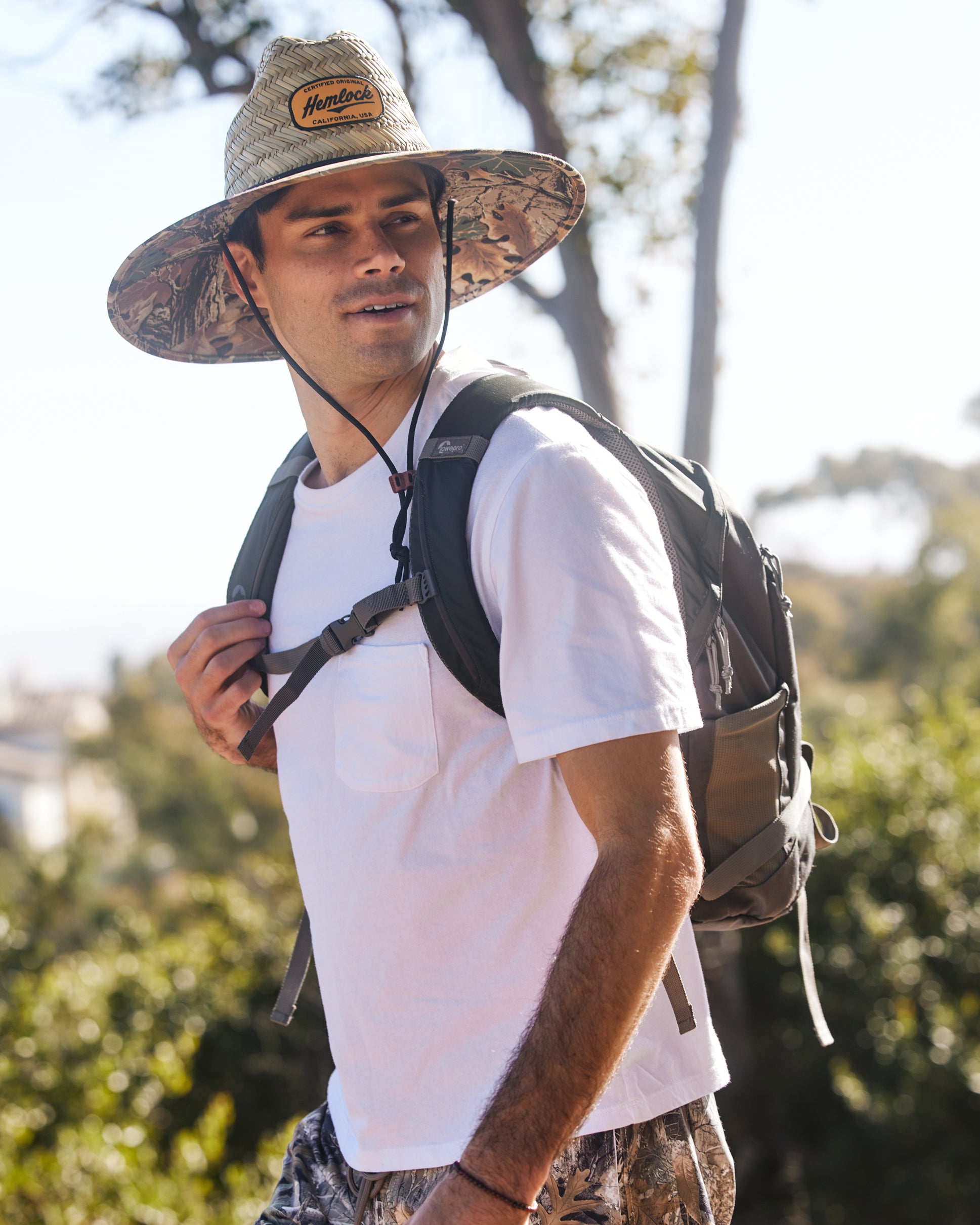 Hemlock male model wearing UPF50+ Lifeguard Straw Hat Realtree® Advantage Camo print