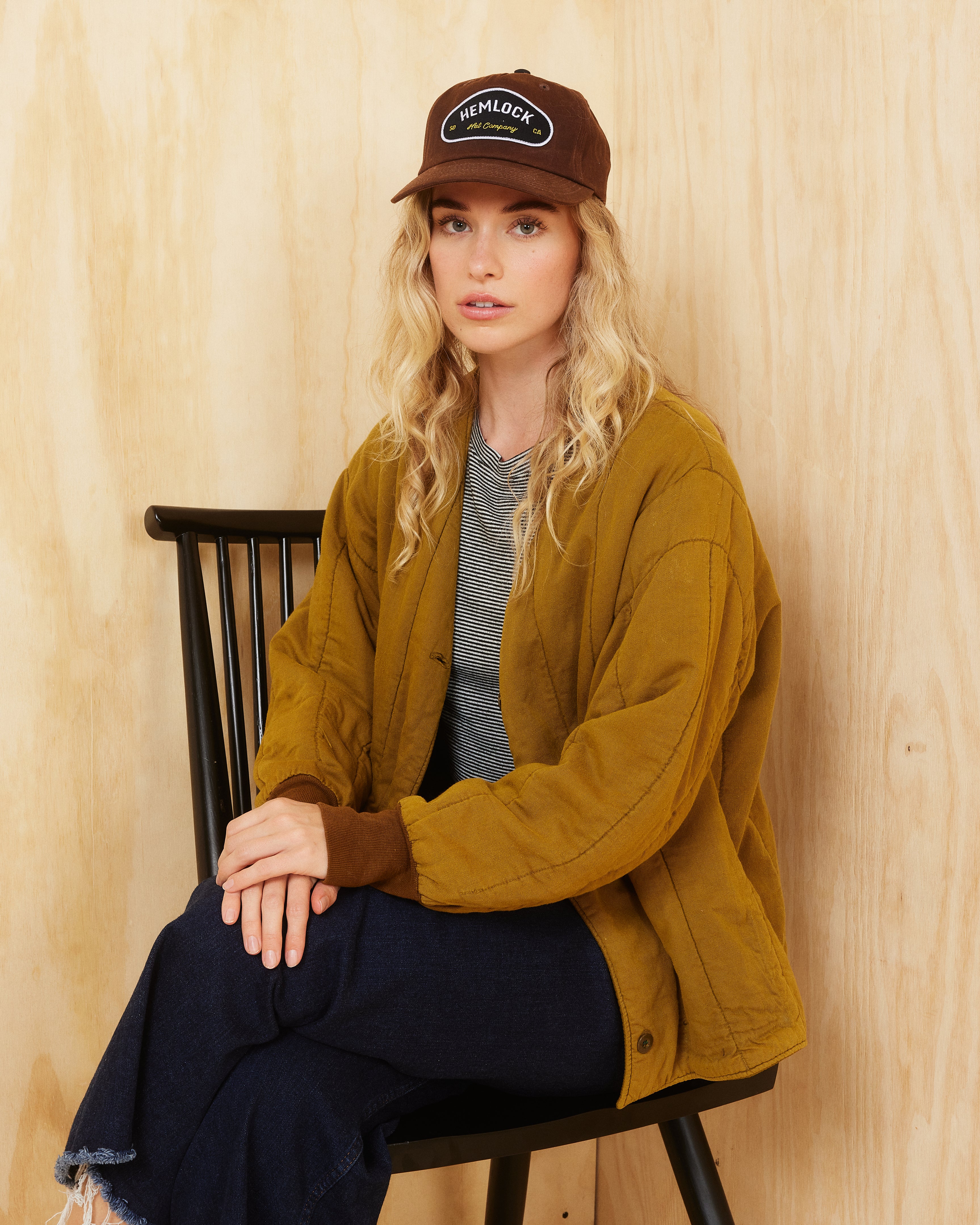 Hemlock female model wearing the Palomar Baseball Hat in Tobacco color