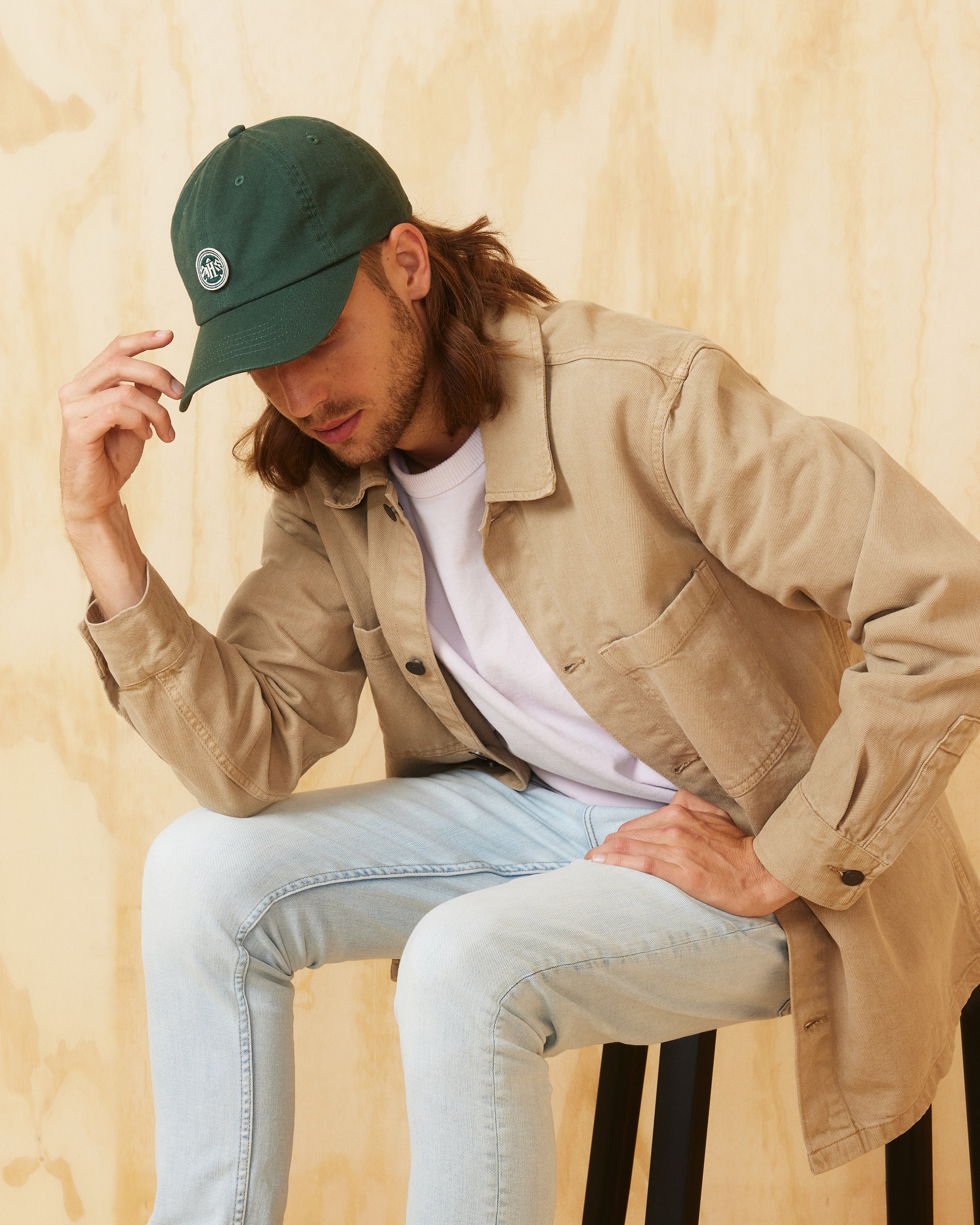 Hemlock male model wearing the Peak Dad Hat in Emerald