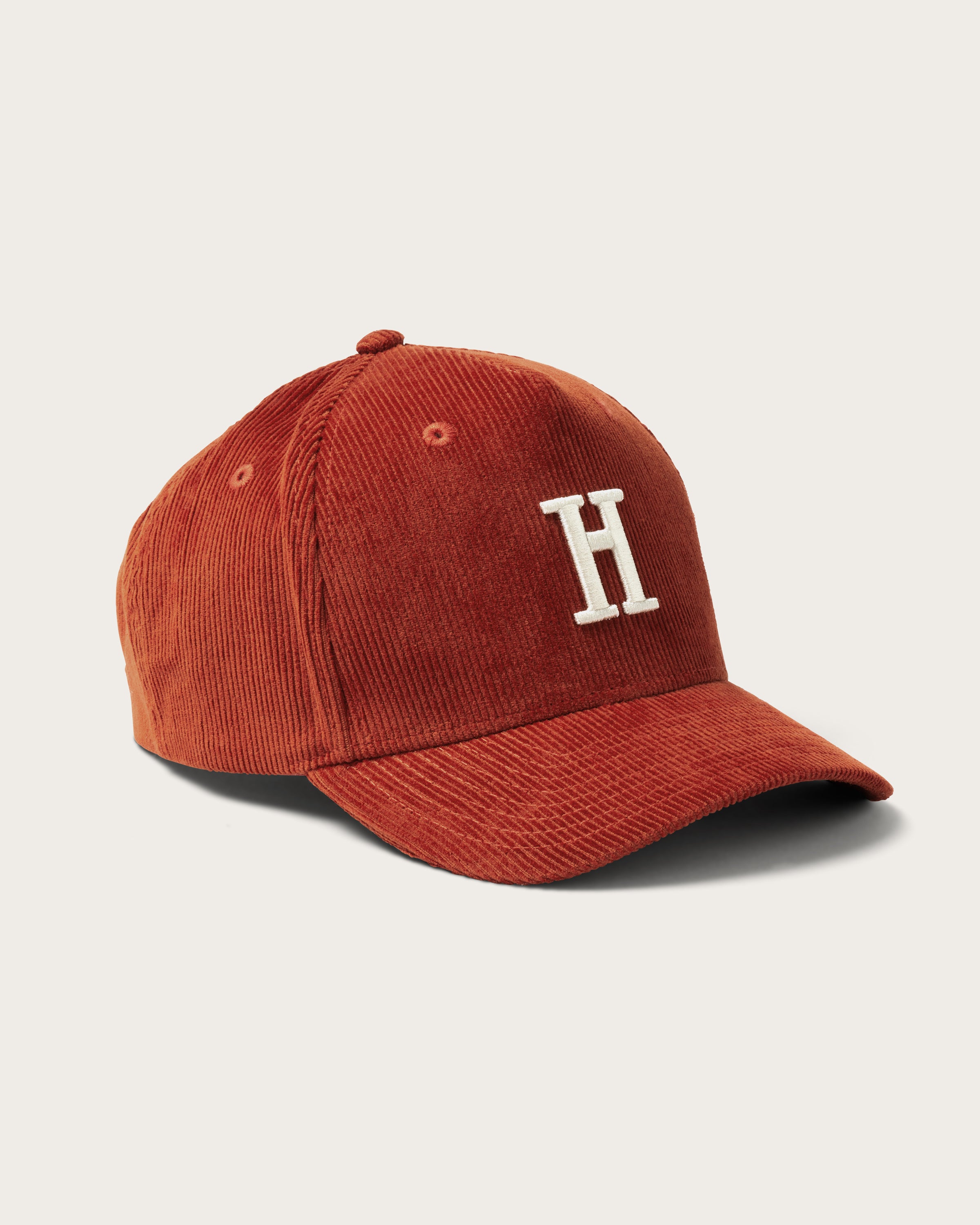 Hemlock Rowan Trucker Hat in Rust color side view